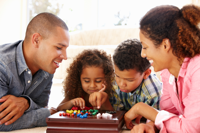 Family playing Chinese checkers together - Family Christmas Gifts - The Grandkid Connection